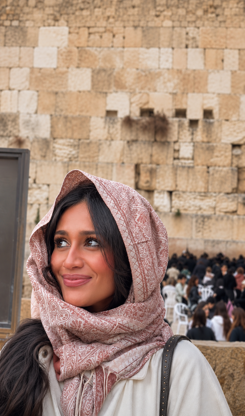 Yzabella standing before the Kotel in Jerusalem